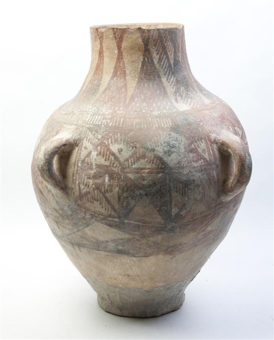 * A Near Eastern Buff Pottery Amphora