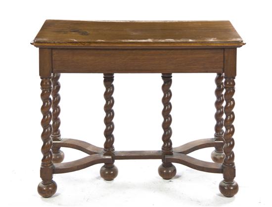 * A Victorian Oak Center Table having