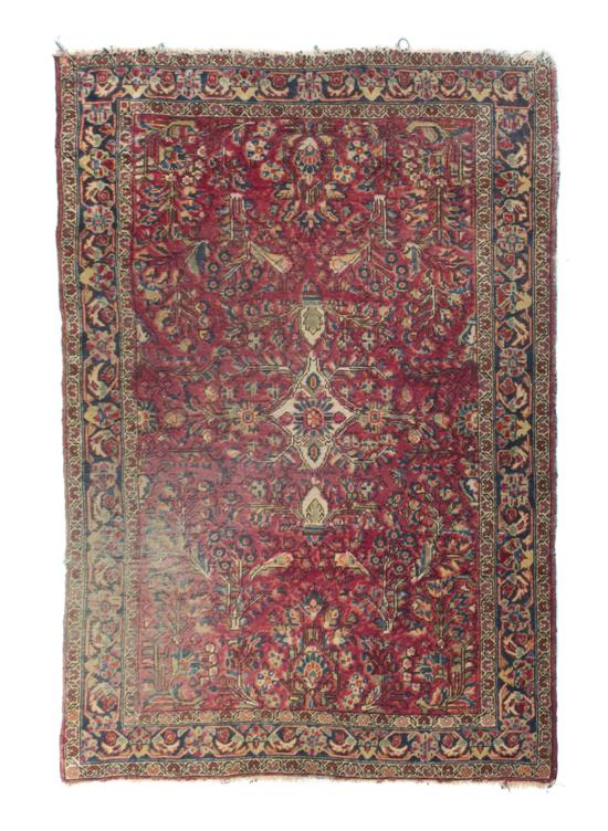 * A Sarouk Wool Rug having a central