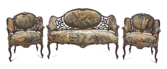 A Rococo Revival Carved and Parcel Gilt