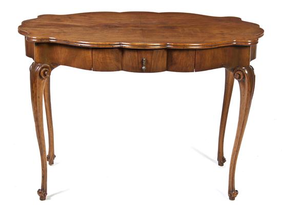 * A Continental Walnut Center Table