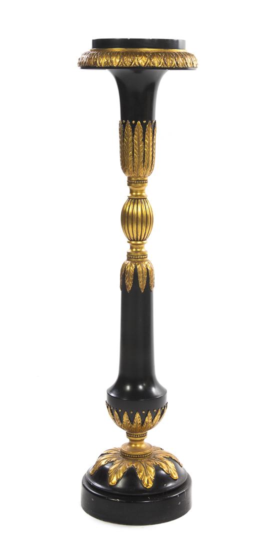 A Neoclassical Ebonized and Parcel Gilt