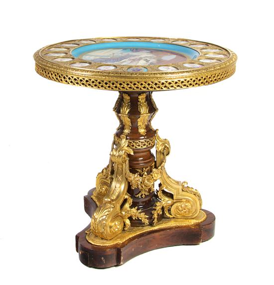 A Sevres Style Porcelain and Gilt Metal