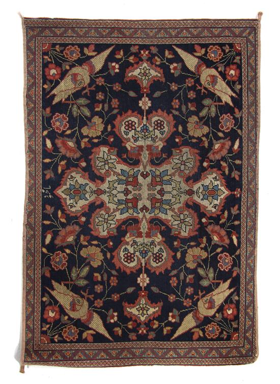 A Persian Wool Mat having a stylized 1527e5
