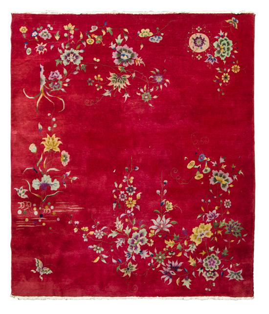 * A Chinese Wool Rug decorated
