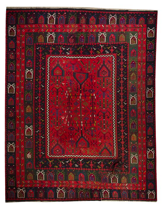 A Kilim Wool Rug decorated with