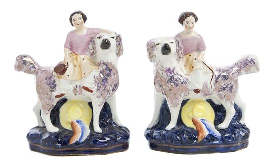 *A Pair of Staffordshire Figural Groups