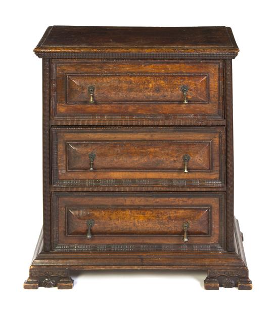 A Continental Walnut Chest of Drawers