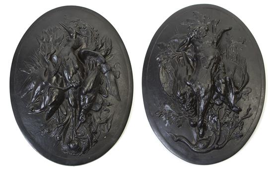 A Pair of Cast Iron Plaques each