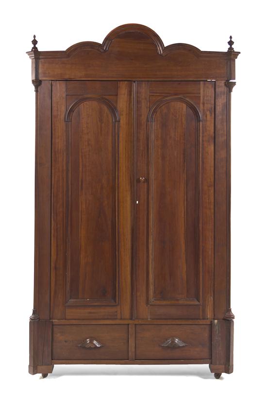 An American Cherry Armoire having an