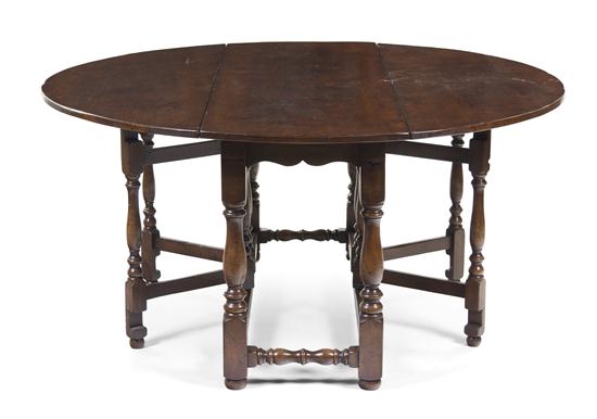 A Jacobean Oak Drop-Leaf Table having