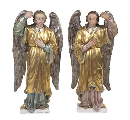 A Pair of Carved and Gilt Models of