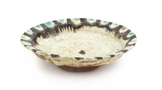 A Middle Eastern Pottery Footed Dish