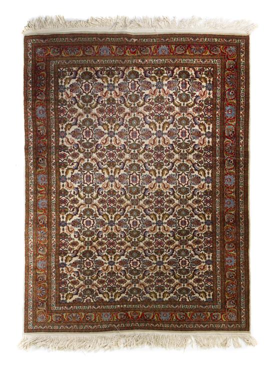 A Persian Wool Rug having a foliate 152cce