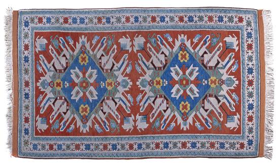  A Kazak Wool Rug having two foliate 152cd7