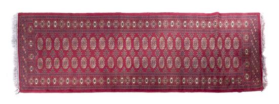 A Bokhara Wool Runner with repeating