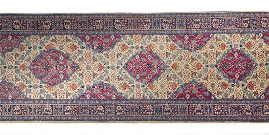 A Persian Wool Runner with repeating 152cde