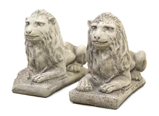 A Pair of Cast Stone Lions each depicted