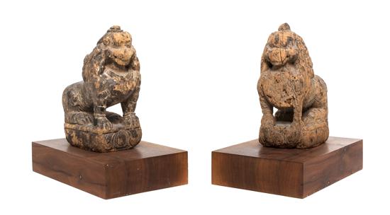 A Pair of Chinese Carved Wood Fu