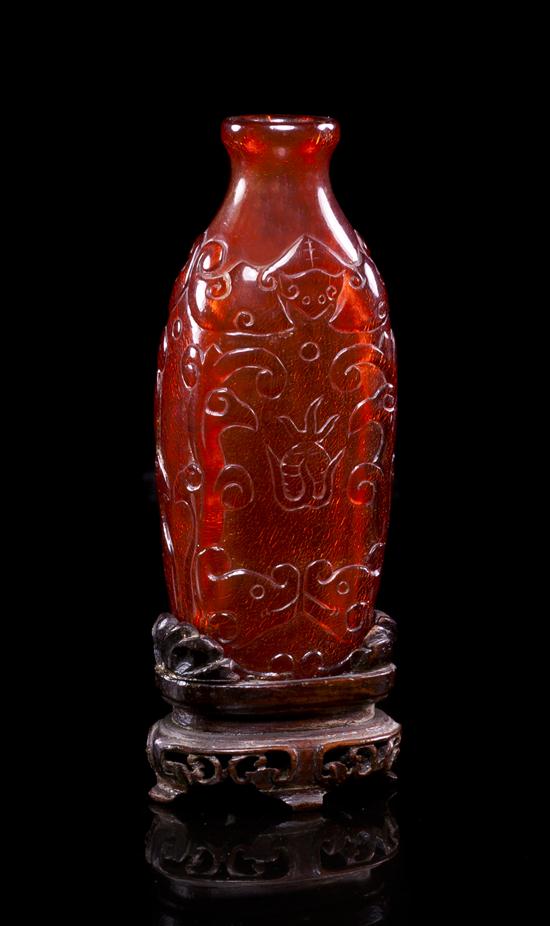 *A Carved Amber Snuff Bottle of