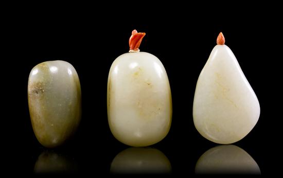 A Group of Three Jade Pebble Form