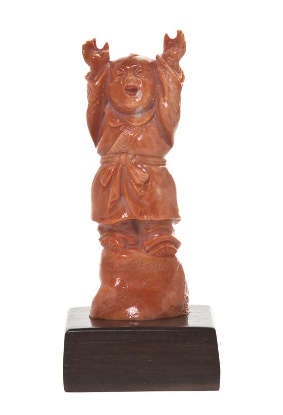 A Chinese Carved Coral Figure of