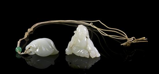 A Group of Two White Jade Toggles 152f8b