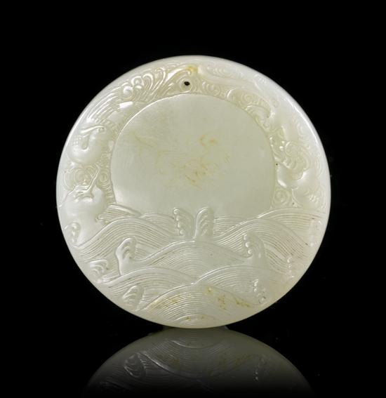 A Chinese Circular Toggle of pale 152f98