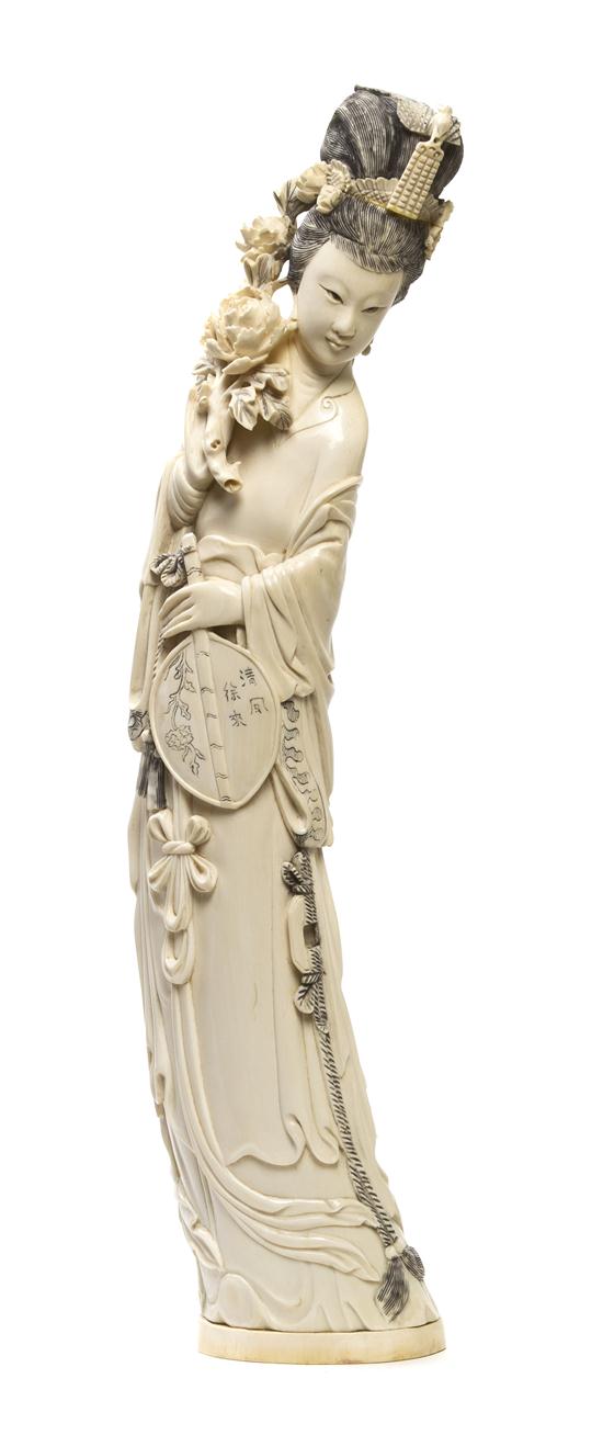 A Chinese Carved Ivory Figure of a Lady