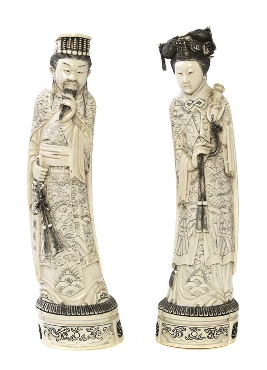 *A Pair of Carved Ivory Figures