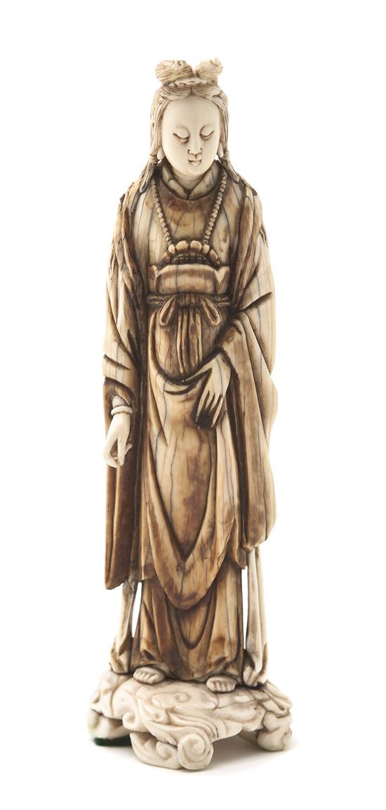 A Chinese Ivory Carving of a Lady depicting