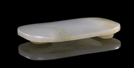 A White Jade Buckle of domed rectangular