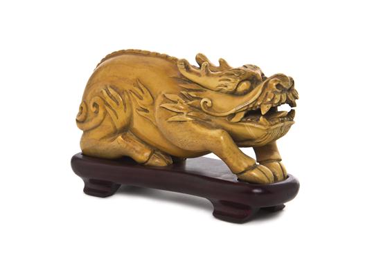 A Chinese Ivory Model of a Beast the