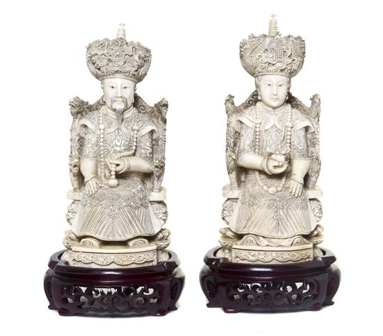 A Pair of Carved Ivory Figures