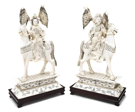 A Pair of Chinese Ivory Figures of an