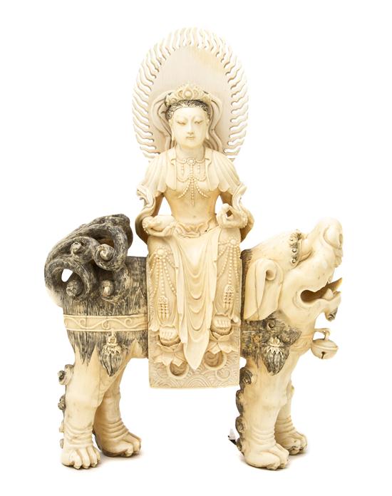 A Carved Ivory Figure of a Deity depicted