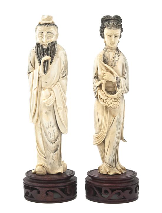 A Pair of Ivory Figures depicting