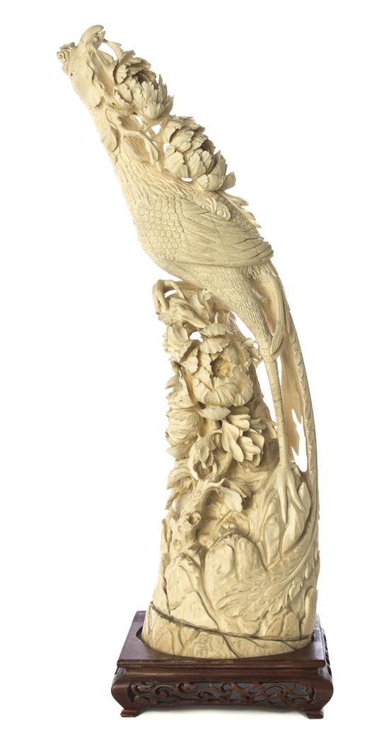 A Chinese Carved Ivory Figure of