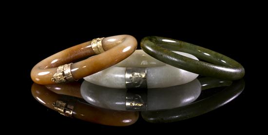 A Group of Three Jade Bangles of 15310f