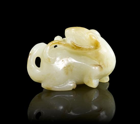 A Carved Jade Toggle of a pale