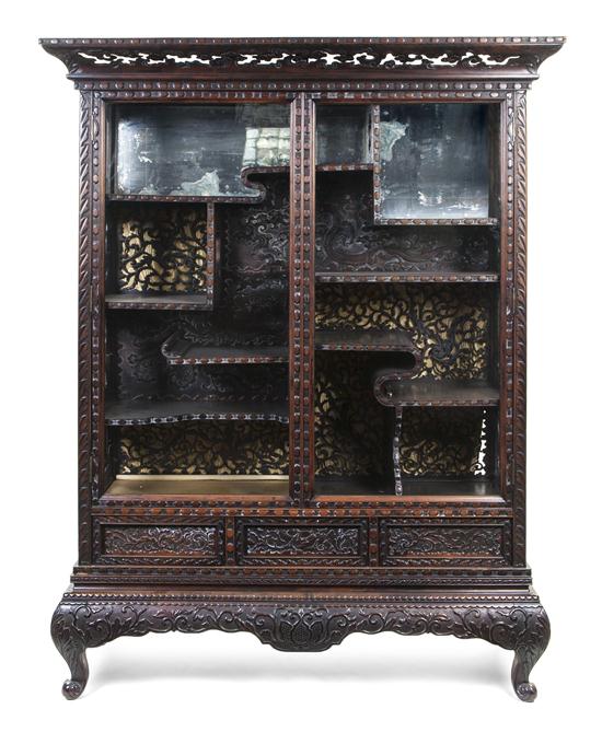 *A Chinese Carved Display Cabinet
