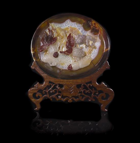 An Agate Plate having high relief decoration