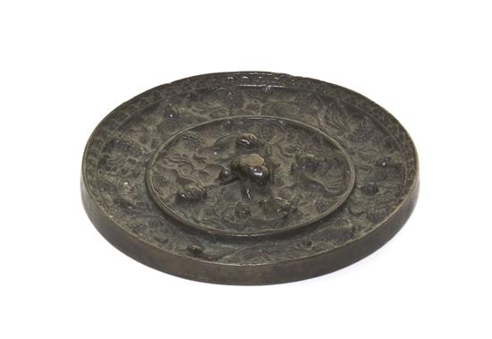 A Chinese Bronze Mirror having