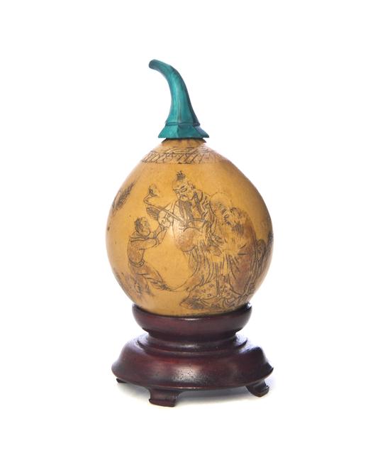 A Carved Gourd Snuff Bottle having