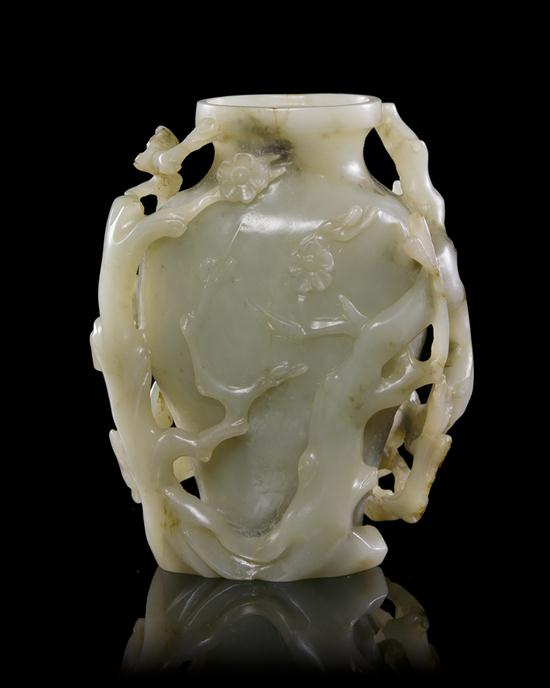 A Carved Jade Vase of pale celadon 15316c