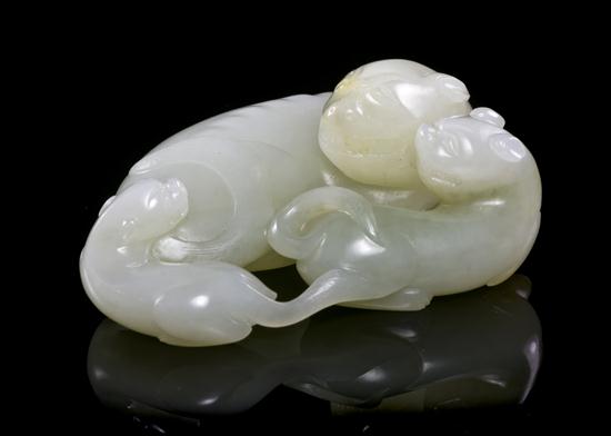 A Jade Carving of a Mother and Two Pups
