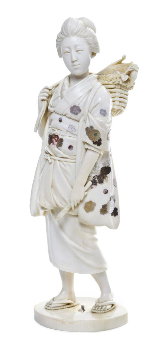 *A Japanese Carved Ivory Figure of a