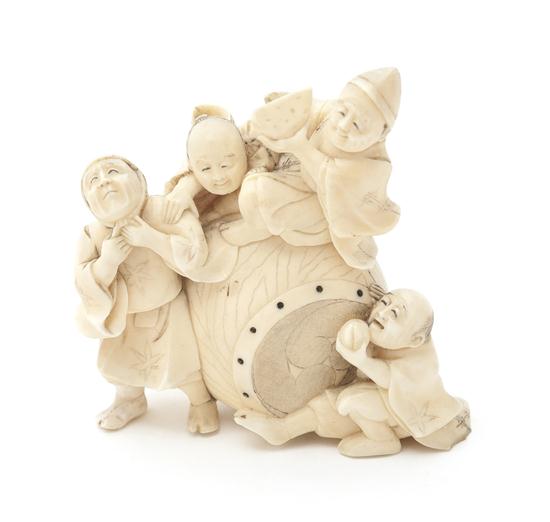 An Ivory Okimono of Four Children