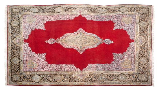 A Kirman Wool Rug the red gold