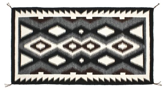A Pair of Black Navajo Rugs the